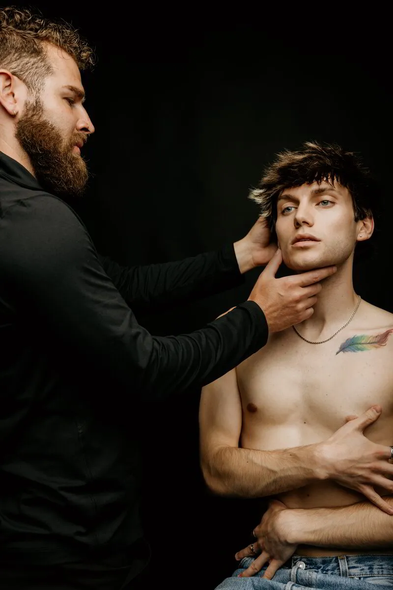 A practitioner guiding a client’s chin during a facial